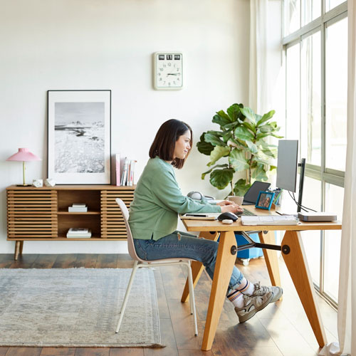 woman sitting at her home workstation