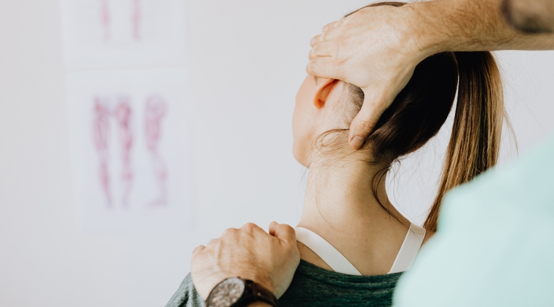 The Impact Of Tech‑Neck: Why Long Hours On Devices Hurt Your Spine 1 woman getting her neck adjusted